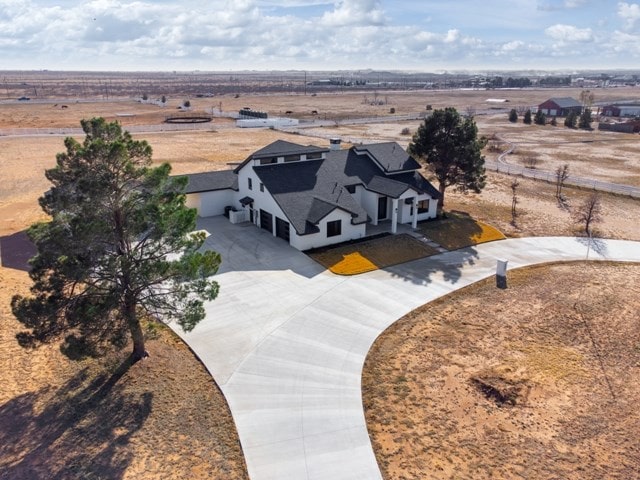 birds eye view of property featuring a rural view