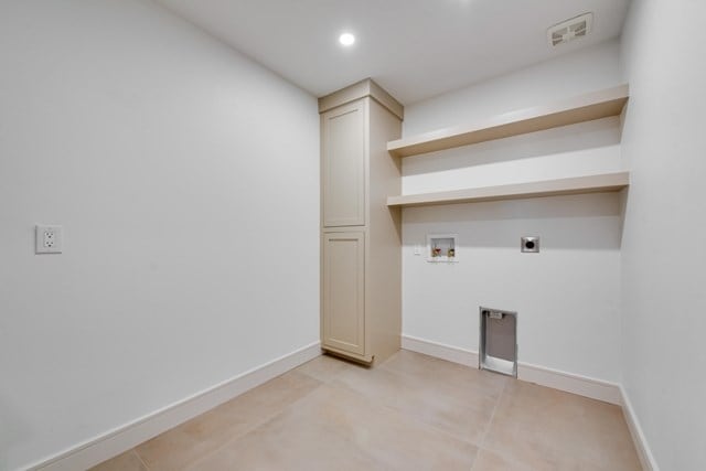 laundry area with light tile patterned floors, electric dryer hookup, and hookup for a washing machine