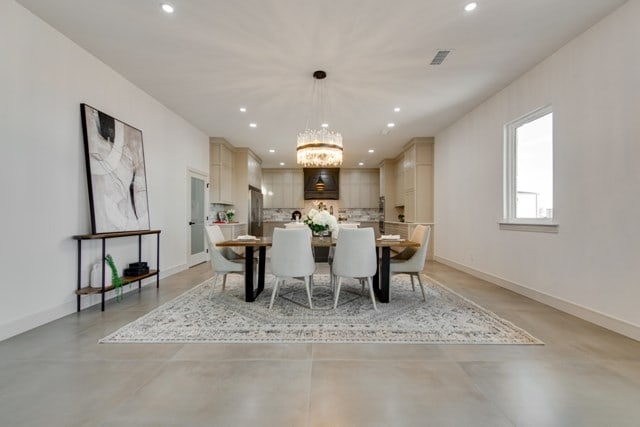 dining space featuring an inviting chandelier