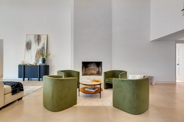 interior space with a large fireplace and tile patterned floors