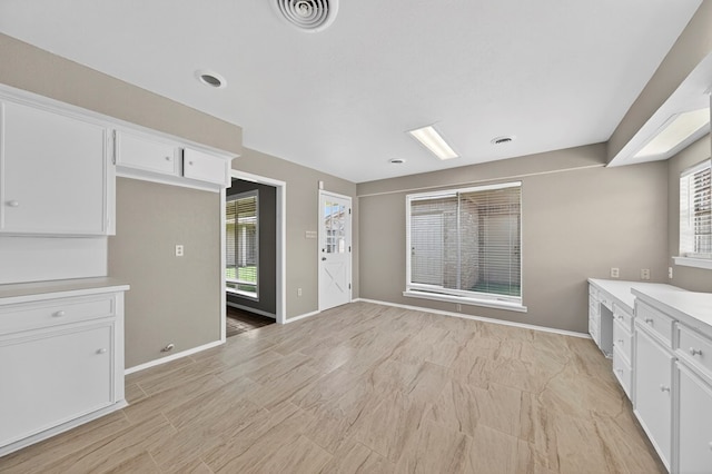 1406 W Pecan, Midland, TX 79705 - kitchen with white cabinetry and light countertops