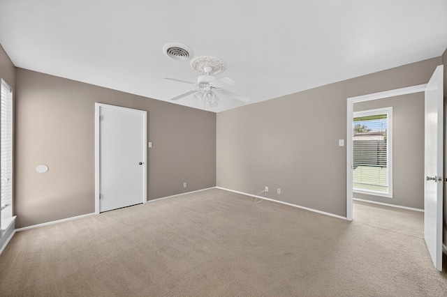 1406 W Pecan, Midland, TX 79705 - carpeted spare room featuring ceiling fan and baseboards