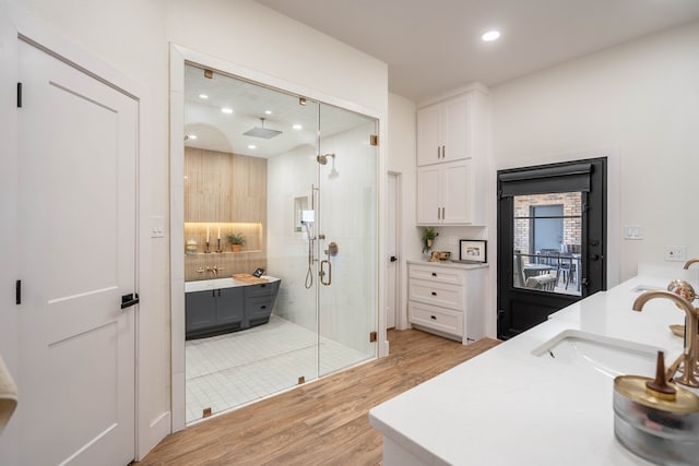 5807 Sterling Pl, Midland, TX 79707 - full bath with double vanity, wood finished floors, a stall shower, and recessed lighting