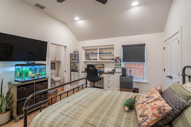 5807 Sterling Pl, Midland, TX 79707 - bedroom featuring vaulted ceiling, wood finished floors, and connected bathroom