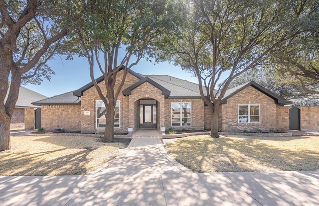 5807 Sterling Pl, Midland, TX 79707 - view of front of house with brick siding and roof with shingles