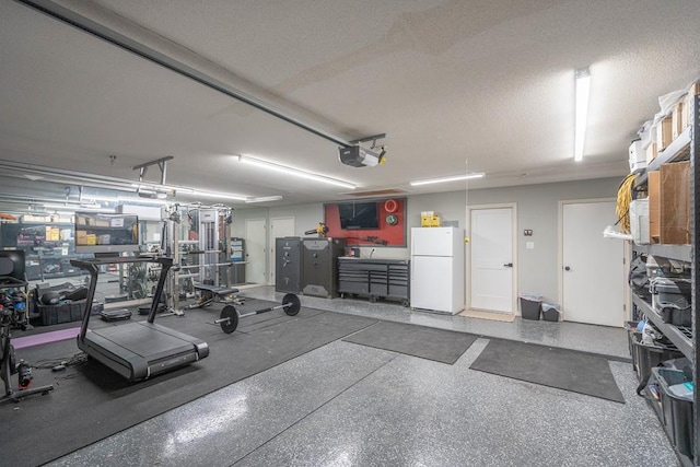 5807 Sterling Pl, Midland, TX 79707 - garage featuring freestanding refrigerator and a garage door opener