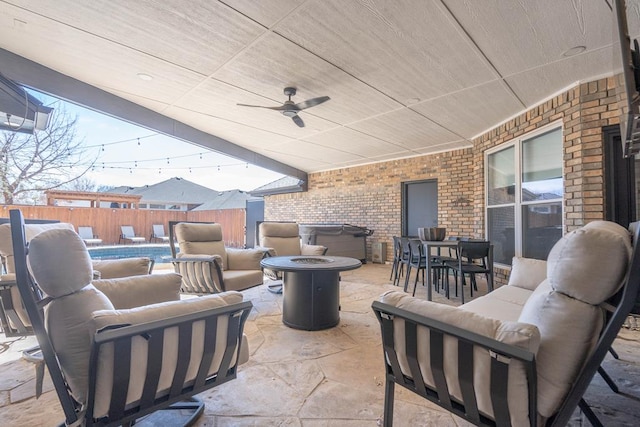 5807 Sterling Pl, Midland, TX 79707 - fenced backyard featuring an outdoor living space with a fire pit, a patio area, and a ceiling fan