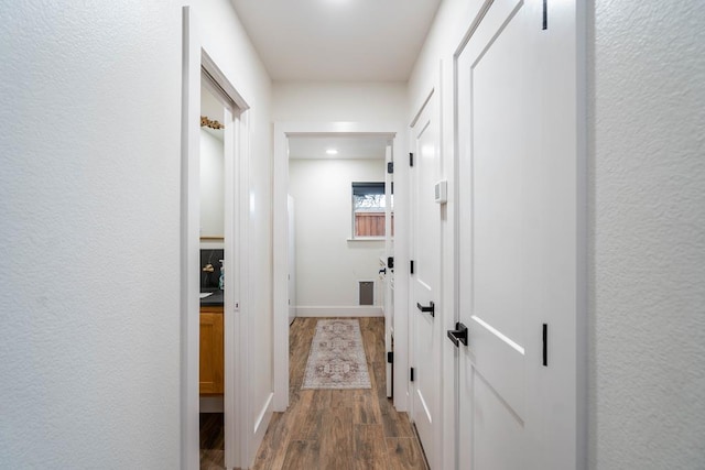 5807 Sterling Pl, Midland, TX 79707 - hallway with wood finished floors and baseboards