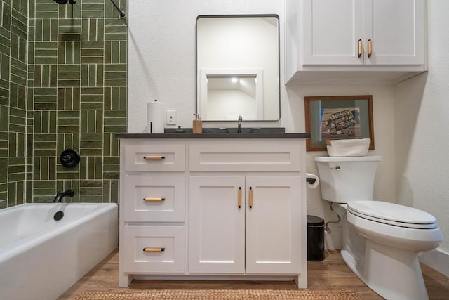 5807 Sterling Pl, Midland, TX 79707 - bathroom featuring vanity, toilet, wood finished floors, and shower / tub combination
