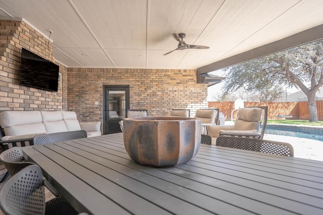 5807 Sterling Pl, Midland, TX 79707 - deck featuring outdoor dining space, a ceiling fan, and a fenced backyard