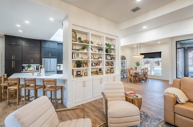 5807 Sterling Pl, Midland, TX 79707 - living area featuring light wood-style floors and recessed lighting
