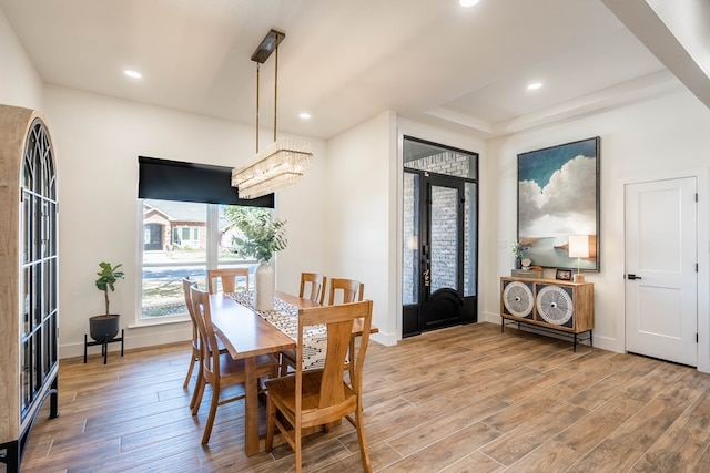 5807 Sterling Pl, Midland, TX 79707 - dining area with light wood finished floors, baseboards, french doors, recessed lighting, and a raised ceiling