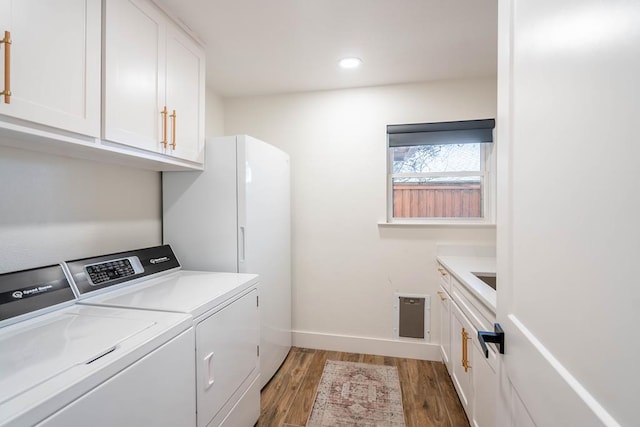 5807 Sterling Pl, Midland, TX 79707 - washroom with separate washer and dryer, cabinet space, light wood-style floors, baseboards, and recessed lighting