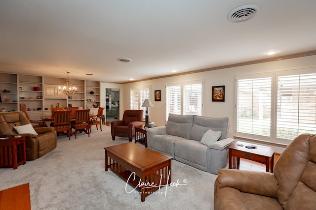 living room featuring light carpet, visible vents, a notable chandelier, and ornamental molding