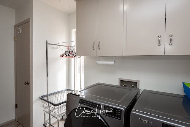 laundry room featuring cabinet space and washing machine and clothes dryer