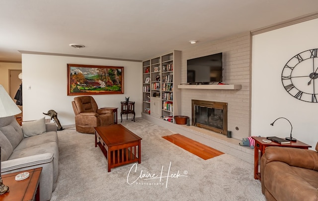 carpeted living room with ornamental molding, a fireplace, and visible vents