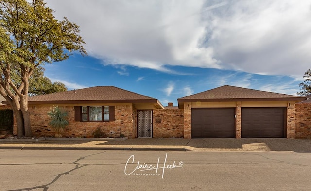 single story home with brick siding