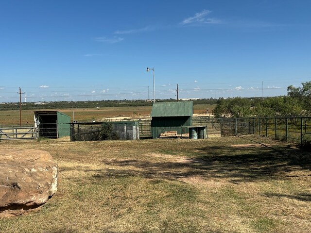 view of outbuilding featuring a rural view