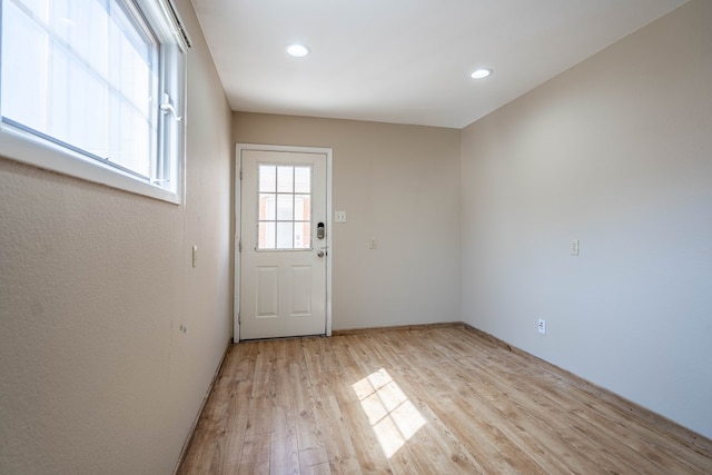 entryway with light hardwood / wood-style floors