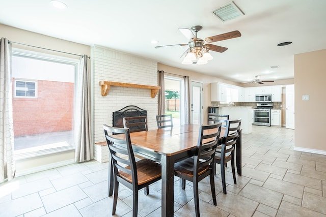 dining area with ceiling fan