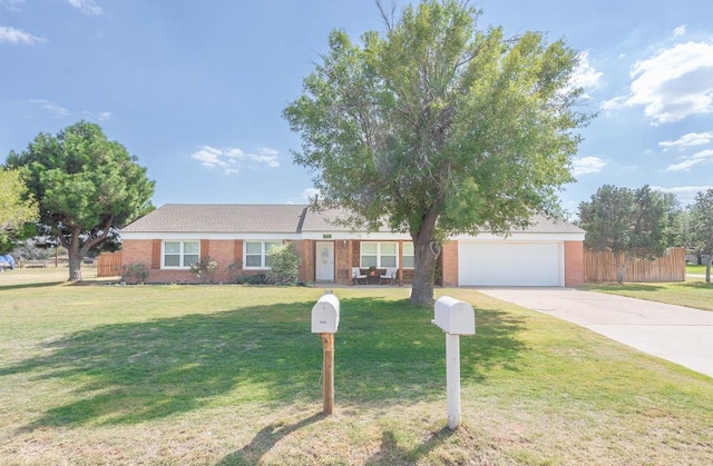 ranch-style home with a garage and a front yard