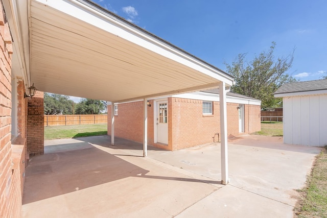 view of patio featuring a storage shed