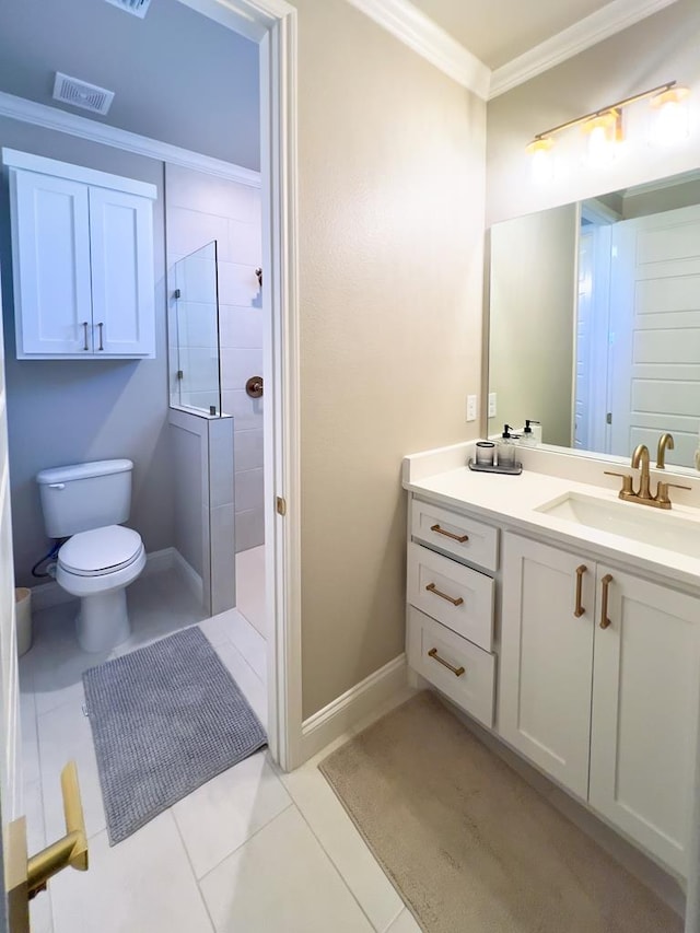 bathroom with a tile shower, tile patterned floors, crown molding, toilet, and vanity