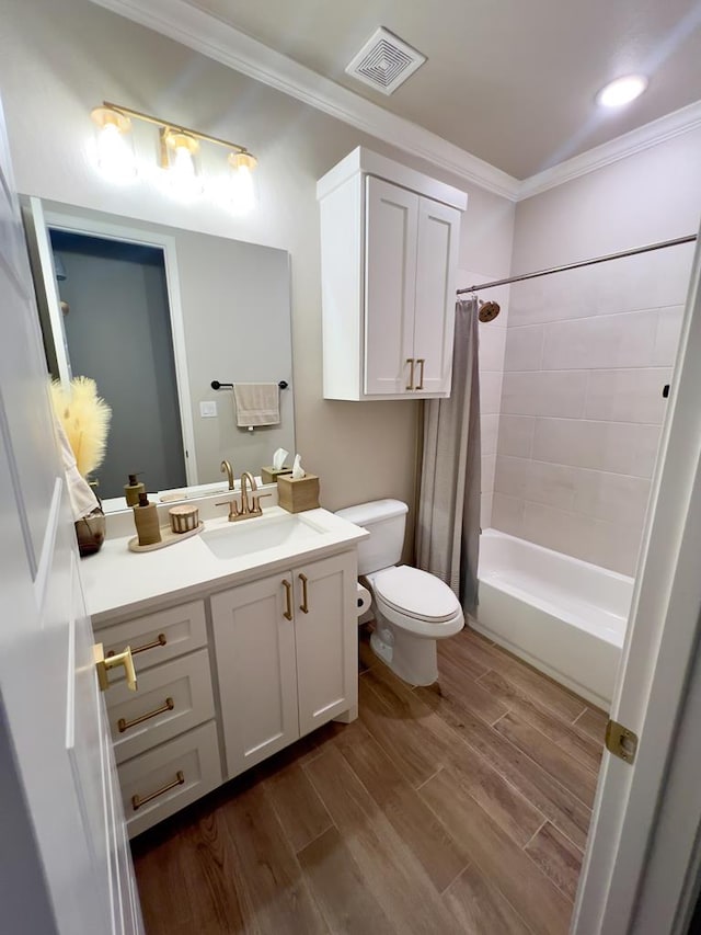 full bathroom featuring shower / bath combo, vanity, crown molding, wood-type flooring, and toilet