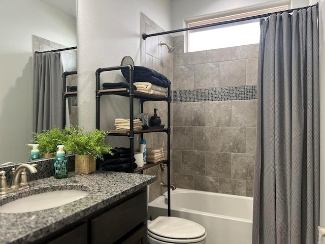 full bath with vanity, toilet, and shower / bath combo with shower curtain