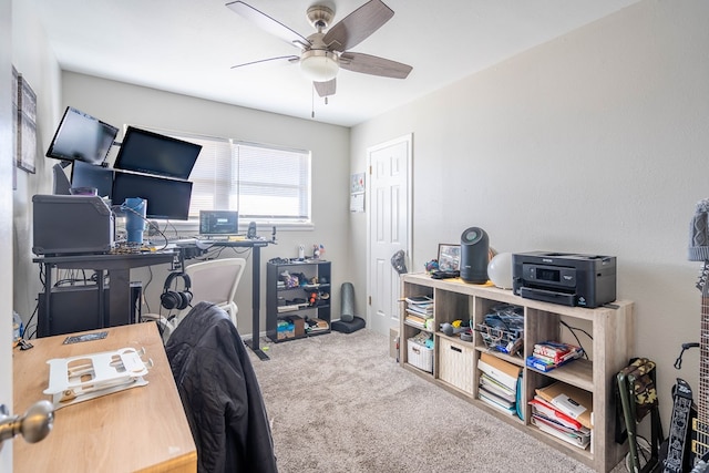 office area with ceiling fan and carpet