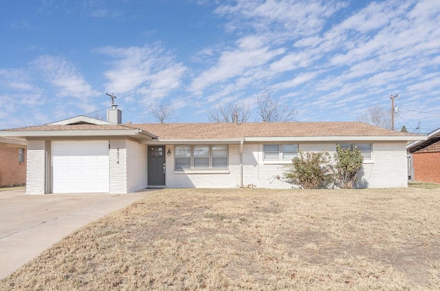 ranch-style house with a front lawn and a garage