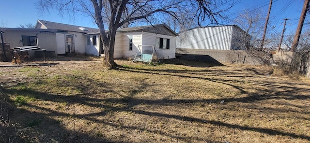 view of home's exterior with a lawn