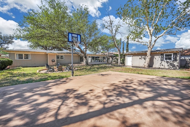 2010 Douglas Ave, Midland, TX 79701 - view of front of house featuring a fire pit and a front lawn
