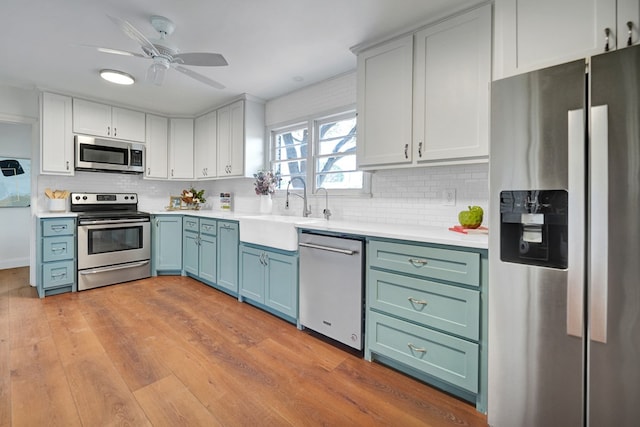 2010 Douglas Ave, Midland, TX 79701 - kitchen featuring stainless steel appliances, decorative backsplash, and light countertops