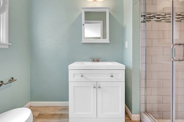 2010 Douglas Ave, Midland, TX 79701 - full bath featuring a shower stall, vanity, and wood finished floors