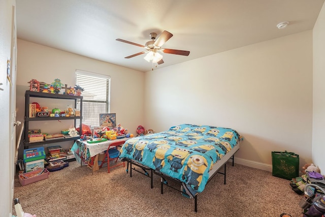 bedroom featuring carpet floors, baseboards, and a ceiling fan