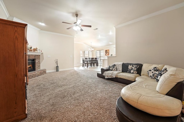 carpeted living area featuring visible vents, baseboards, crown molding, a brick fireplace, and ceiling fan with notable chandelier