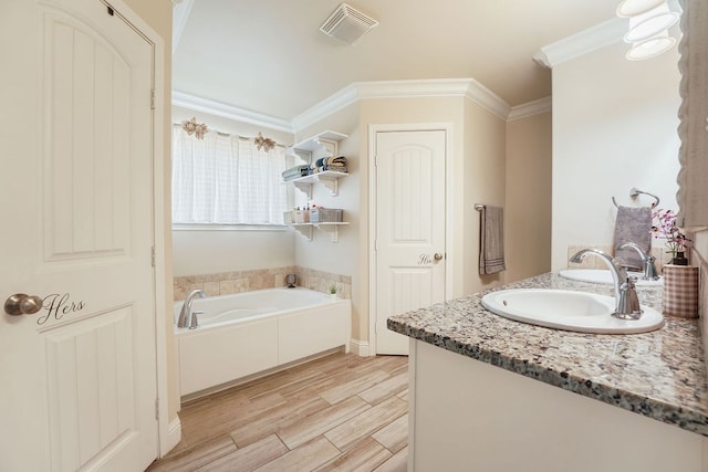 full bathroom with visible vents, ornamental molding, a sink, wood finished floors, and a bath