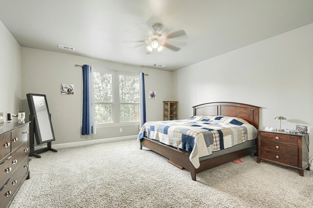 1706 Overshine Ln, Midland, TX 79705 - carpeted bedroom featuring baseboards and a ceiling fan