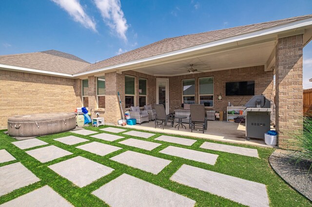 1706 Overshine Ln, Midland, TX 79705 - view of patio / terrace featuring a hot tub, a ceiling fan, and an outdoor living space