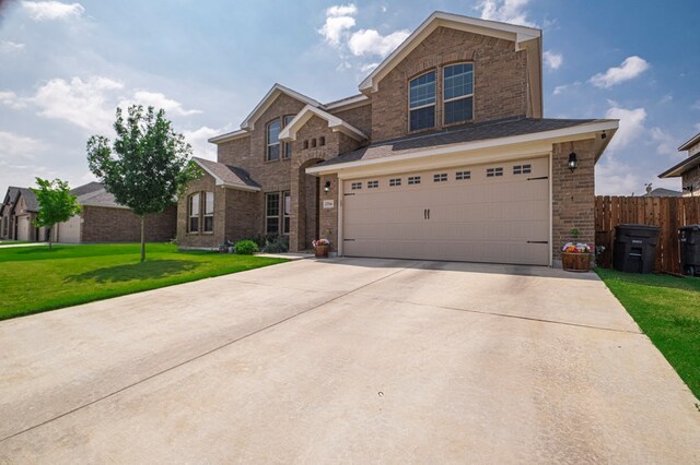 1706 Overshine Ln, Midland, TX 79705 - traditional-style house featuring brick siding, driveway, and an attached garage