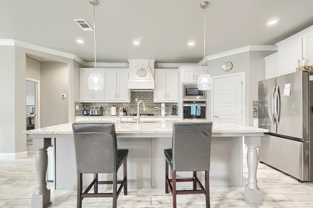 1706 Overshine Ln, Midland, TX 79705 - kitchen with stainless steel appliances, ornamental molding, decorative backsplash, premium range hood, and white cabinetry
