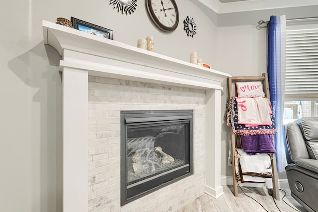1706 Overshine Ln, Midland, TX 79705 - detailed view of wood finished floors, a fireplace, and baseboards