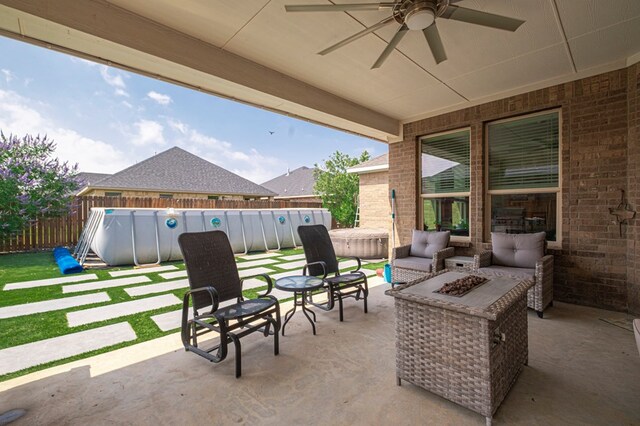 1706 Overshine Ln, Midland, TX 79705 - view of patio / terrace with a ceiling fan and an outdoor living space with a fire pit