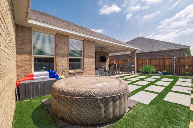 1706 Overshine Ln, Midland, TX 79705 - fenced backyard featuring ceiling fan and a patio area