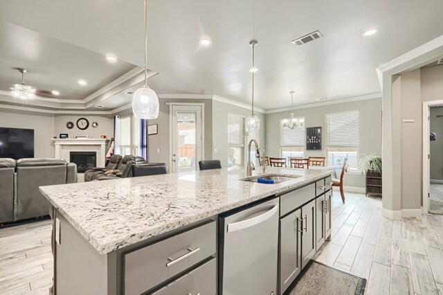 1706 Overshine Ln, Midland, TX 79705 - kitchen featuring a sink, stainless steel dishwasher, ornamental molding, ceiling fan, and gray cabinets