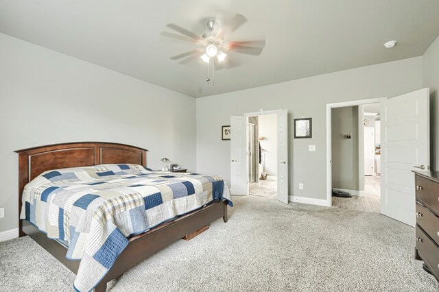 1706 Overshine Ln, Midland, TX 79705 - bedroom featuring light colored carpet, baseboards, and a ceiling fan