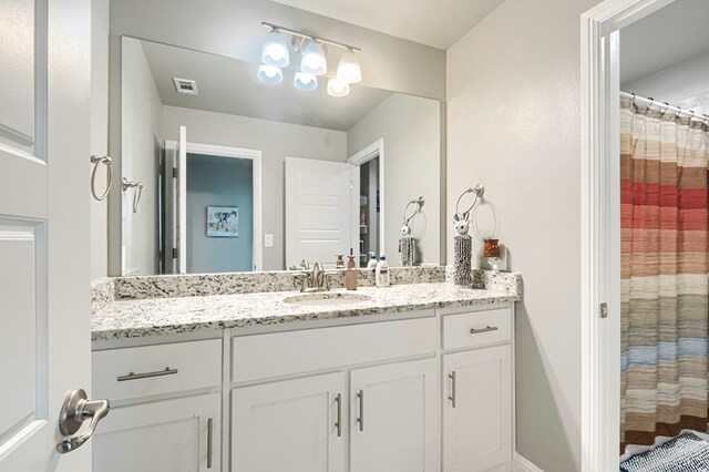 1706 Overshine Ln, Midland, TX 79705 - full bath with vanity and a shower with shower curtain