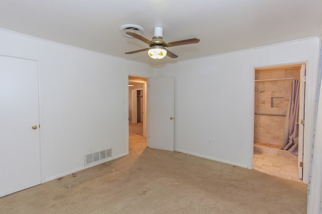 unfurnished bedroom with light carpet, connected bathroom, ceiling fan, and ornamental molding