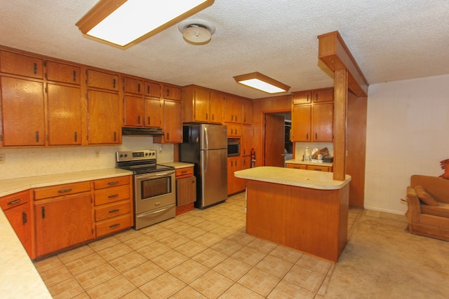 kitchen featuring appliances with stainless steel finishes and a textured ceiling